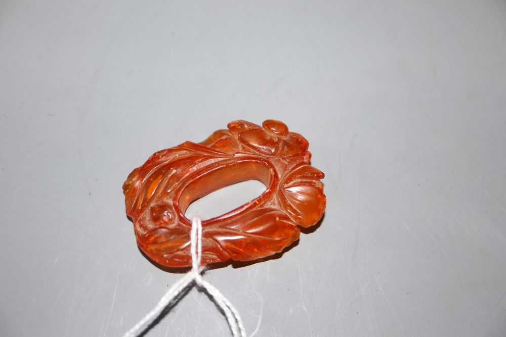 A Chinese carved amber pendant